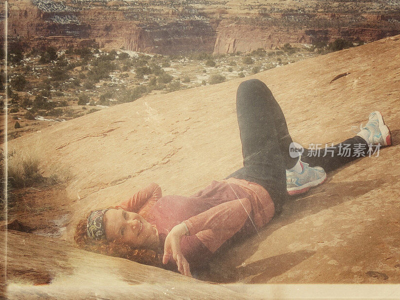 Hiker Relaxing, Laying Down, Whale Back Hike Summit, Canyonlands, Utah